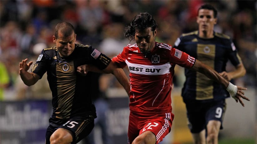 Wilman Conde of the Chicago Fire move the ball past the Union