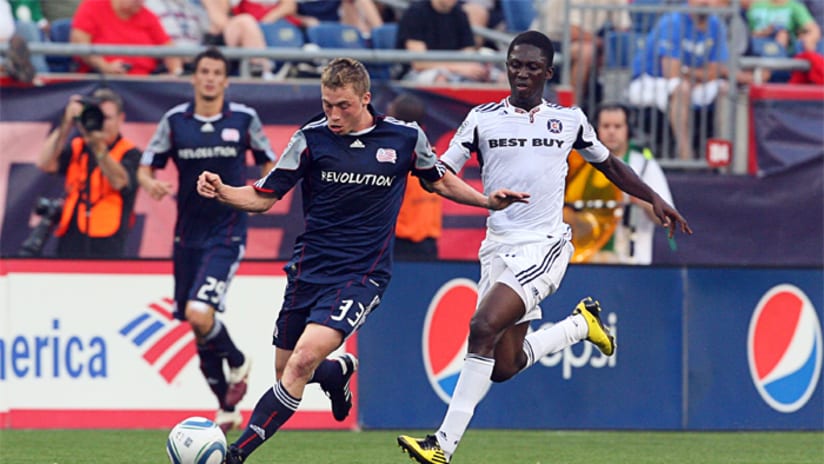 Zak Boggs of the New England Revolution and Patrick Nyarko of the Chicago Fire
