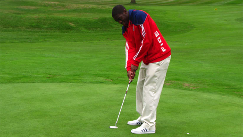 Sean Johnson looks on after a putt