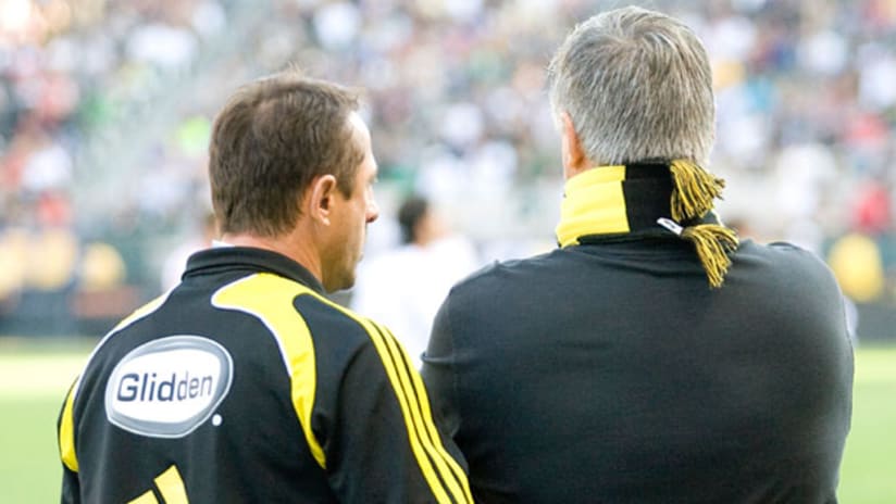 Former Crew coach Sigi Schmid (right) is back in the mix to face Columbus head coach Robert Warzycha on Saturday in Seattle.