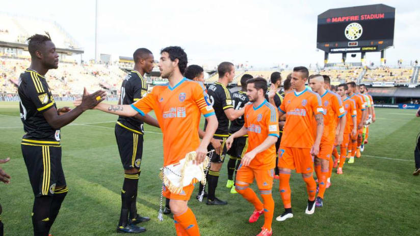 Valencia/Crew SC players shake hands