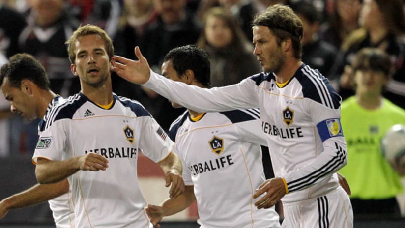 Mike Magee and David Beckham celebrate Magee's goal against D.C. United.