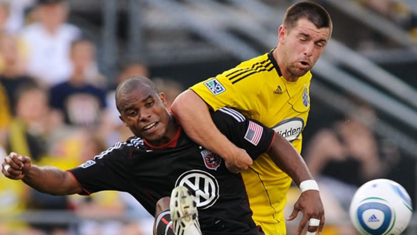 D.C. United's Julius James (left) battles for possession with the Crew's Jason Garey on Saturday night in Columbus.