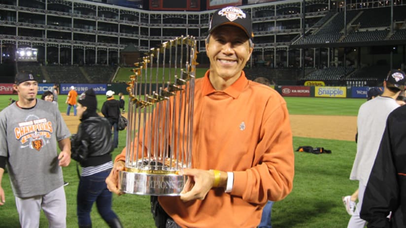 DC United and SF Giants owner Will Chang proudly holds the 2010 World Series trophy