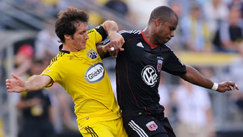 Shutting down the Crew's Guillermo Barros Schelotto (left) is a priority for Julius James and D.C. United in Wednesday's US Open Cup semifinal.