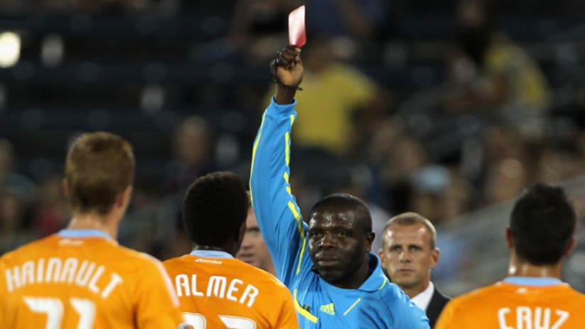 Referee Abby Okulaja shows the red card to Dynamo midfielder Lovell Palmer on Saturday