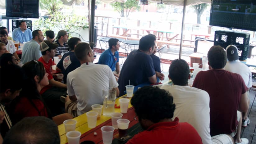 US and England fans in Houston watch their sides advance to the second round.