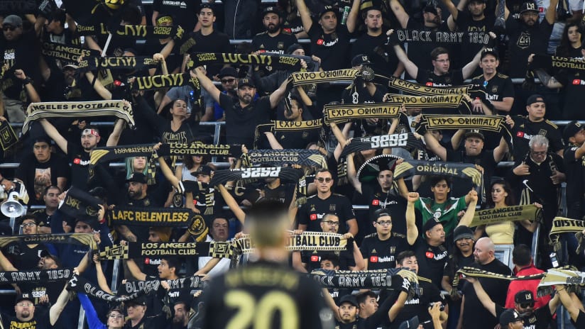 LAFC Supporters With Scarves Up Atuesta In Foreground 2018 IMG