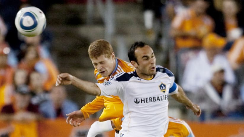 Landon Donovan and Andrew Hainault clash for a head ball in Houston