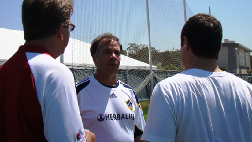 Bruce Arena speaks to the media after training