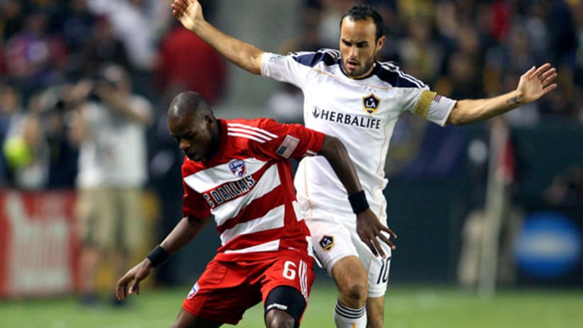 LA's Landon Donovan (right) and FCD's Jackson fight for possession on Sunday.