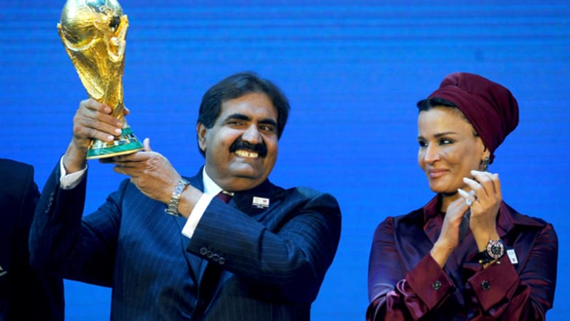 Qatar's Sheikh Hamad bin Khalifa Al-Thani and Sheikha Mozah bint Nasser Al Missned lift the World Cup trophy.