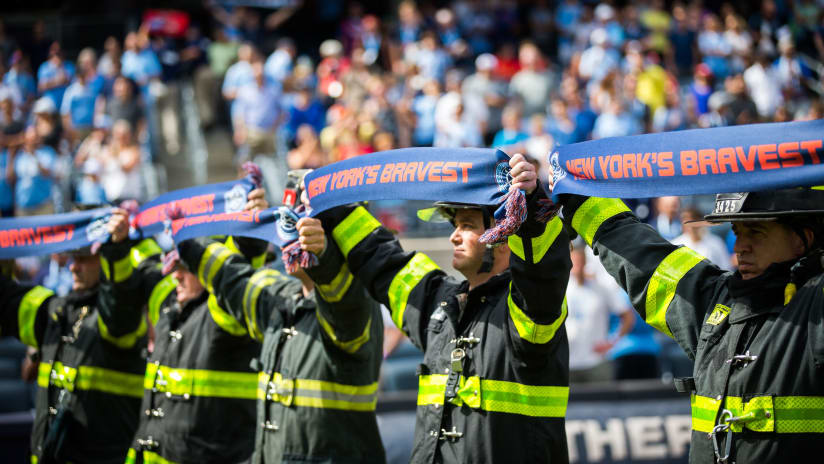 FDNY holding up scarf