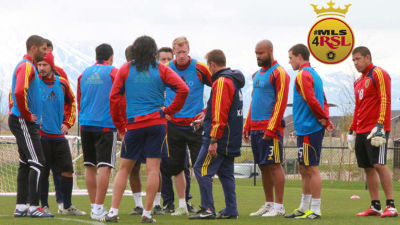 Real Salt Lake players gather around manager Jason Kreis for a team talk ahead of CCL final