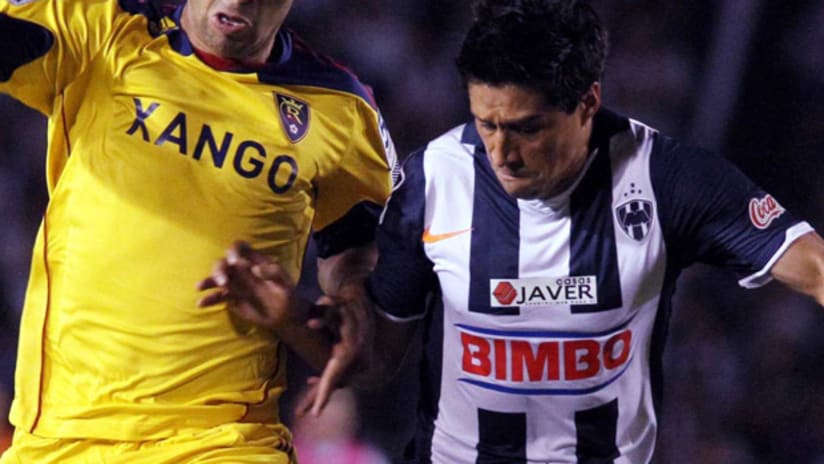 Monterrey's Ricardo Osorio battles with an RSL player in the first leg of their CCL final.