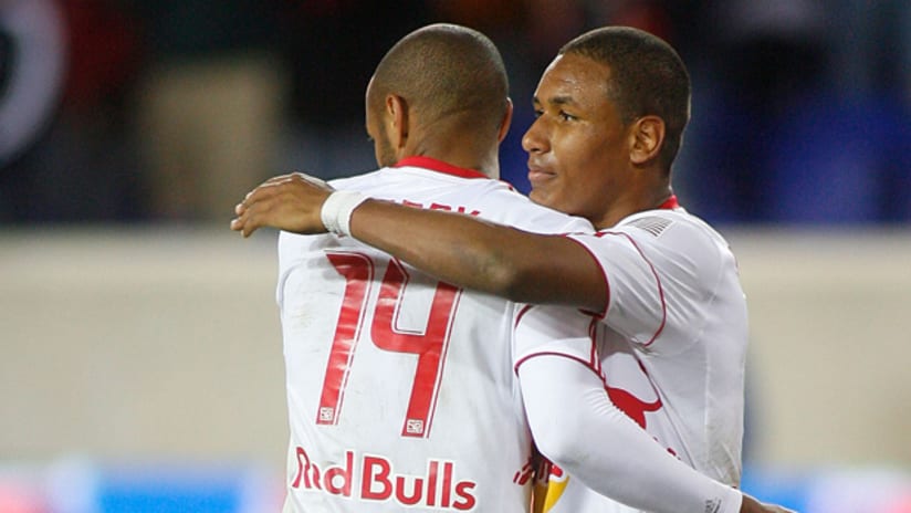 New York's Juan Agudelo (right) embraces Thierry Henry after the Red Bulls' match against Seattle on March 19.