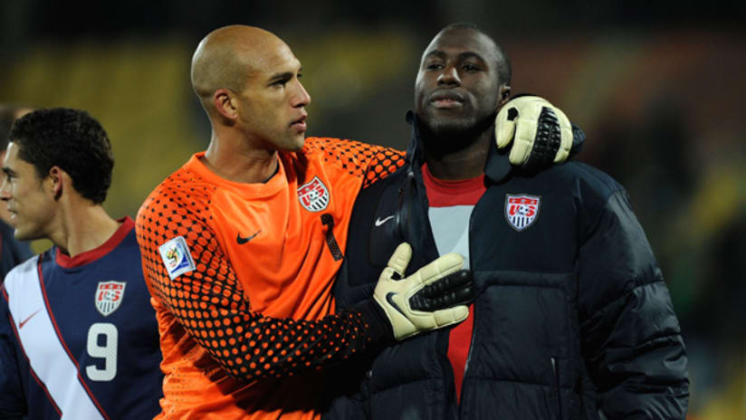 Tim Howard congratulates Jozy Altidore for a good performance against England.