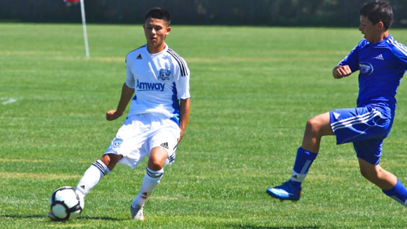 Anthony Zuniga (left) looks up field against the Central California Blues