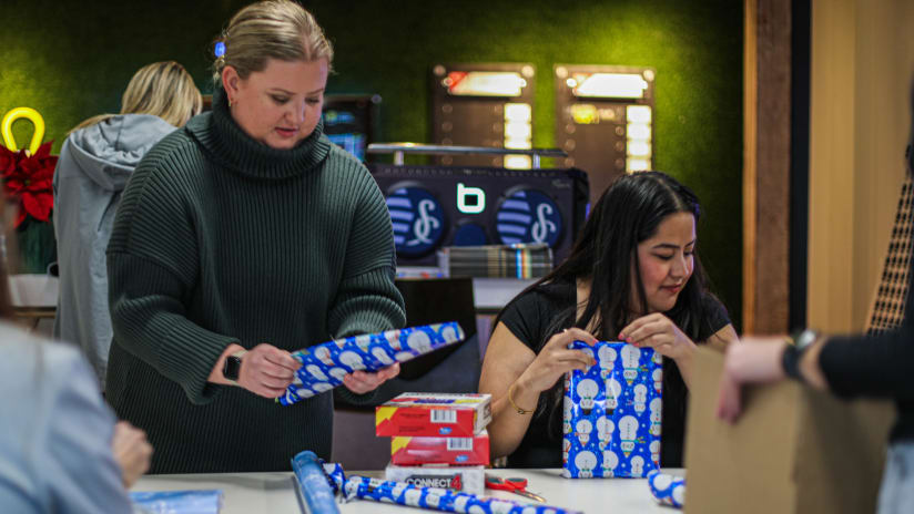 Sporting KC associates support The Victory Project by hand-wrapping gifts for 2023 matchday honorees