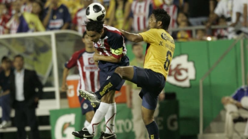Omar Bravo goes up for a header against Club America in 2009 at Arrowhead Stadium.