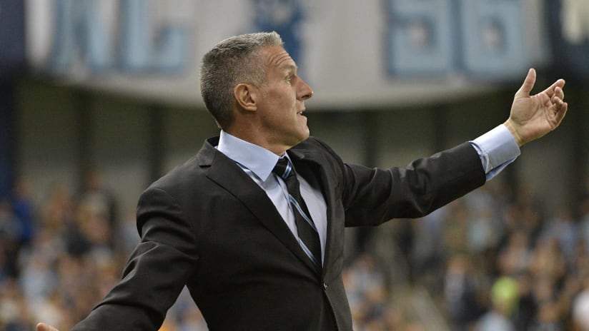 Sporting KC Manager Peter Vermes arms out