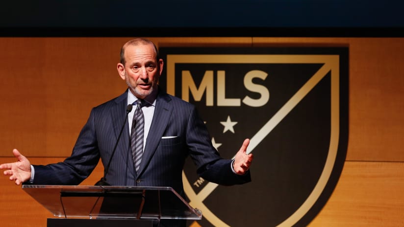 Don Garber at podium - MLS logo in background