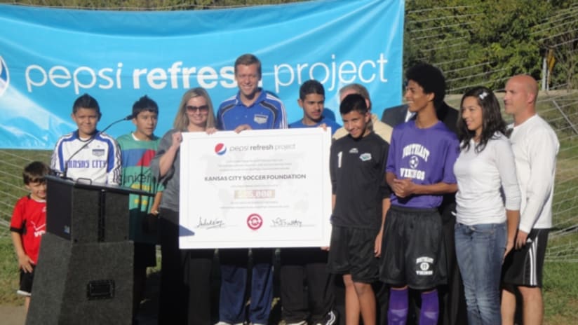 Jimmy Conrad, Pepsi officials presented a $25K check to Belvidere Park