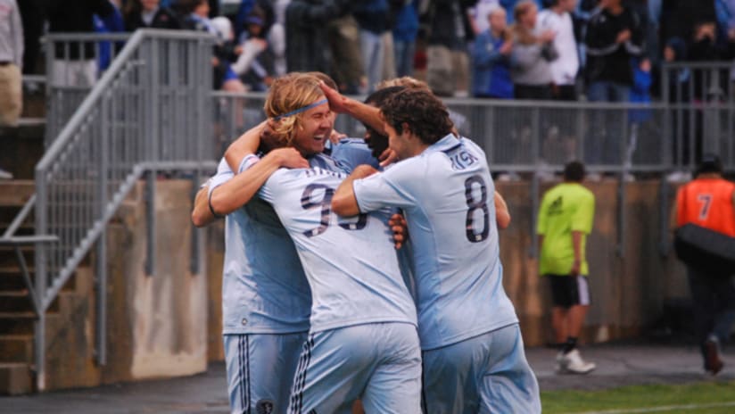 Sporting KC celebrates in their 5-0 victory over New England