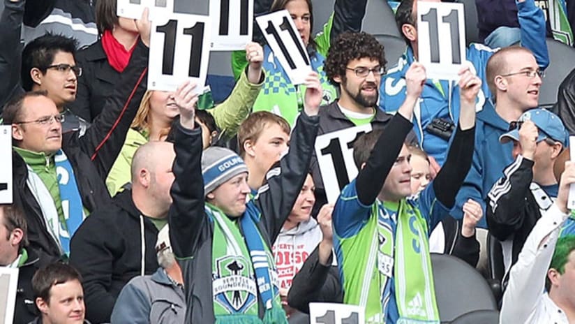 Seattle Sounders fans raise Steve Zakuani's number 11.