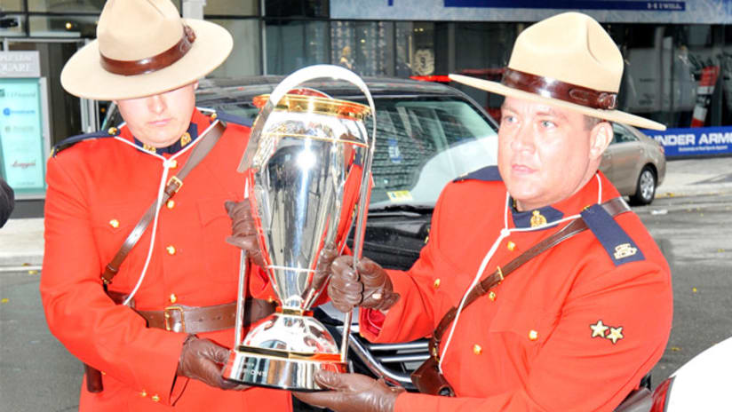 Mounties carry MLS Cup into Air Canada Centre.