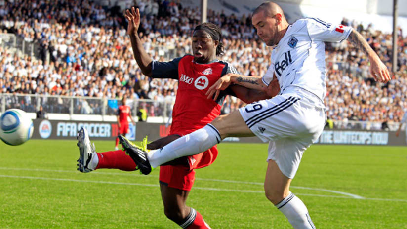 TFC defenders had their hands full with Eric Hassli (R) and Vancouver.