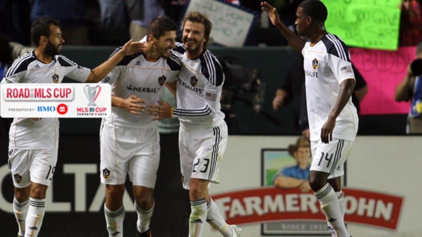 David Beckham congratulates Omar Gonzalez on his goal.