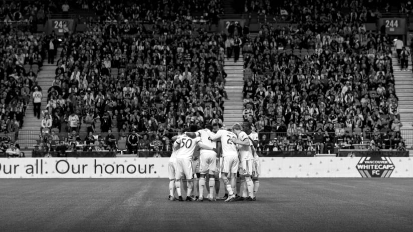 Pre-match huddle - BC Place - wide - black and white - OAOH