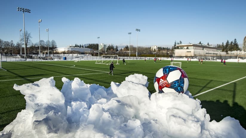 NSDC turf with ball, snow in foreground