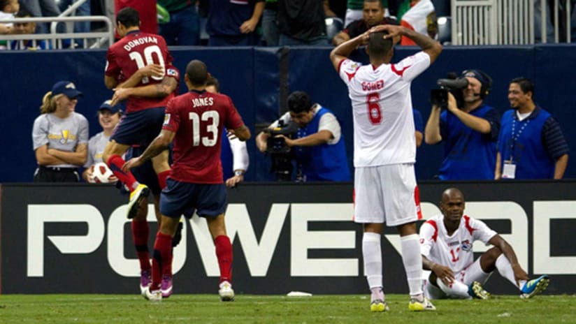 Landon Donovan and Jermain Jones celebrate with goal scorer Clint Dempsey in the US' 1-0 win vs. Panama.