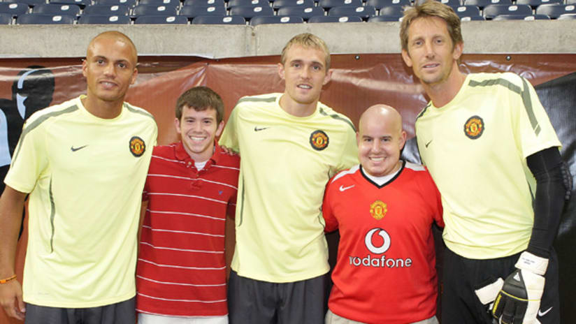 Matthew Otten (right) fulfills a childhood dream of meeting Manchester United players at Reliant Stadium.