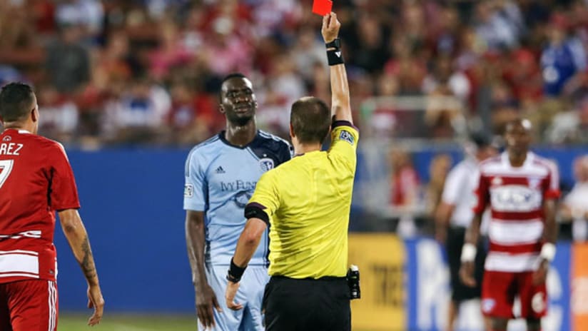 Sporting Kansas City's C.J. Sapong is shown red by referee Mark Geiger