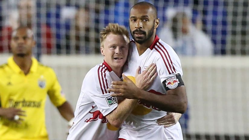 Thierry Henry and Dax McCarty celebrate a goal vs. Columbus (Sept. 15, 2012)