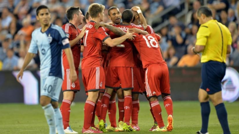 Toronto FC huddle after scoring against Sporting KC