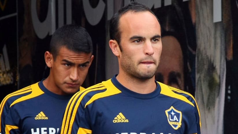 Landon Donovan stares intently in the direction of a soccer field.