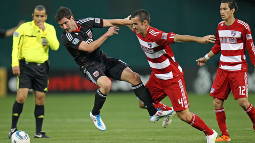 D.C. United's Chris Pontius (left) gets shoved off the ball by Andrew Jacobson of FC Dallas on Saturday at RFK Stadium.