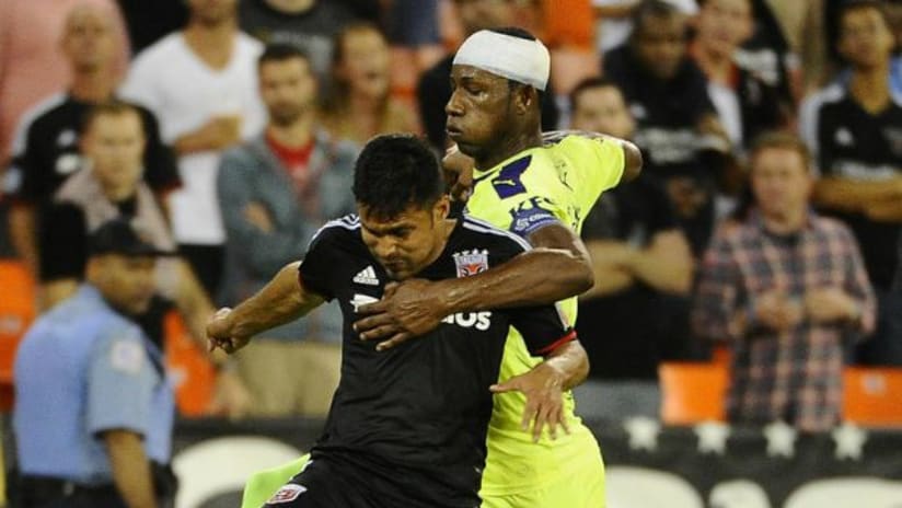 D.C. United's Jairo Arrieta battles with Arabe Unido's Fidel Caesar in CONCACAF Champions League play