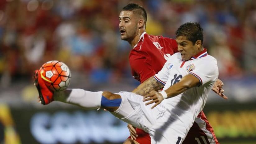 Costa Rica's Christian Gamboa and Canada's Marcus Haber in Gold Cup action