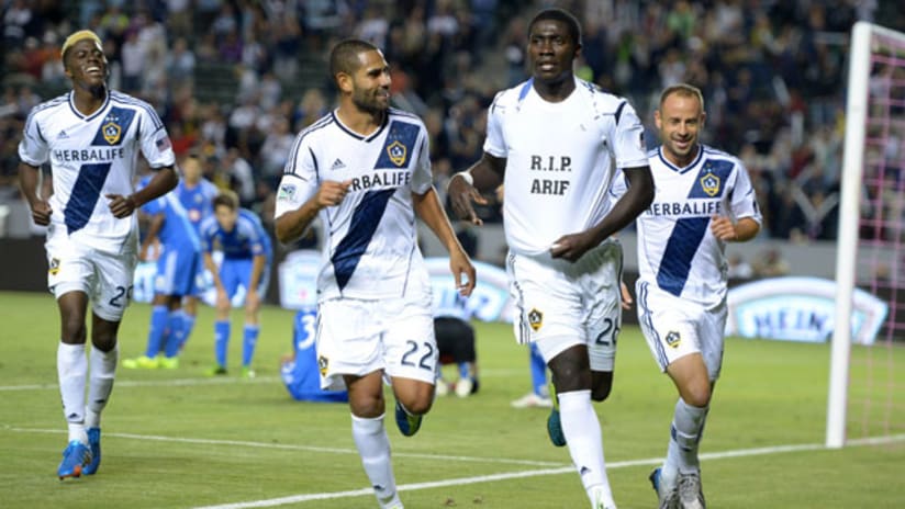 LA's Kofi Opare celebrates his goal with Leonardo and Laurent Courtois