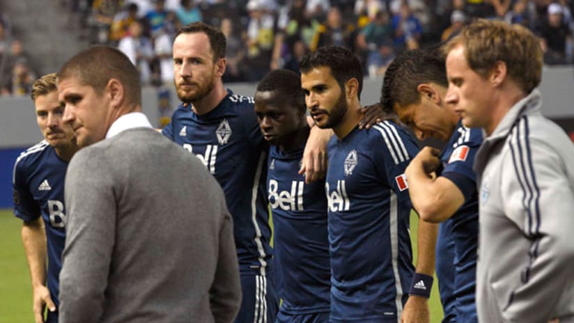 Vancouver Whitecaps Carl Robinson gathers his players