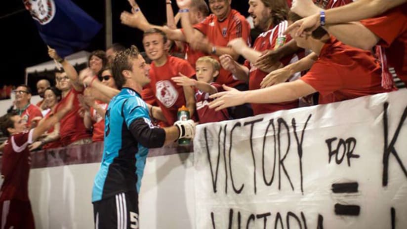 Andrew Dykstra celebrates with Richmond Kickers fans
