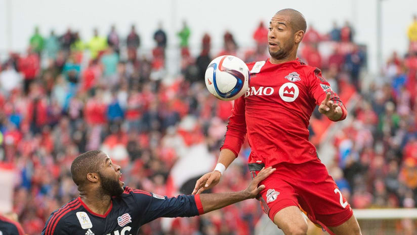 Justin Morrow leaps into the air for Toronto FC