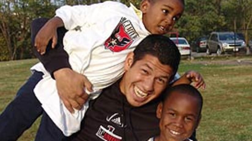 Nick Rimando (center) made some new friends at the soccer clinic.