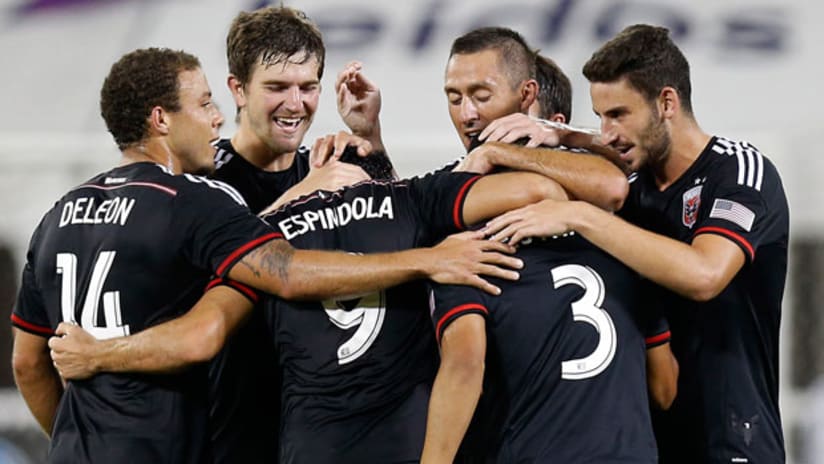 D.C. United celebrate with Fabian Espindola