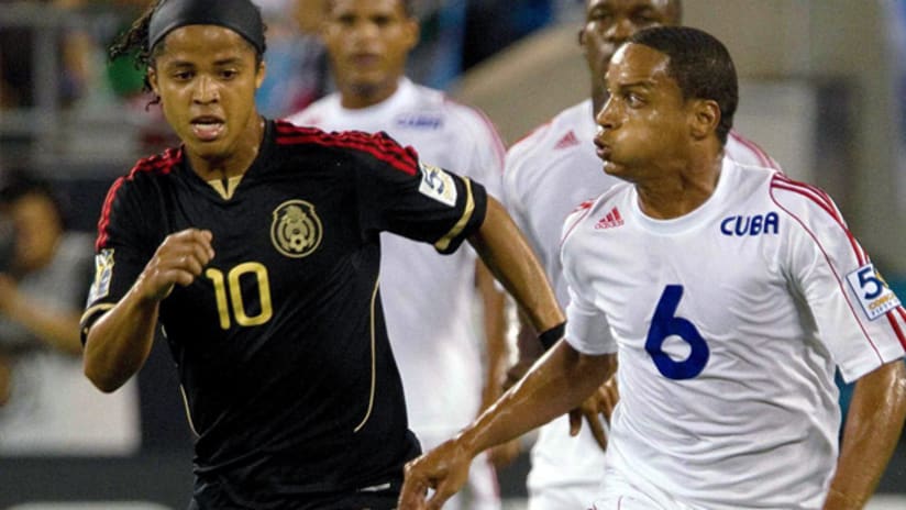 Mexico's Giovani dos Santos (left) tallied twice in a 5-0 win over Cuba.